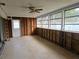 Under construction sunroom with large windows and wood framing at 4354 50Th S Ter, St Petersburg, FL 33711