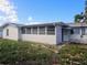 White single story house with screened porch and needs some exterior work at 4354 50Th S Ter, St Petersburg, FL 33711