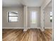 Bright and airy entryway with hardwood floors and neutral walls at 5479 Brussels Ter, Port Charlotte, FL 33981