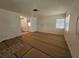 Large living area with vinyl flooring, and access to other rooms at 469 80Th Way, St Pete Beach, FL 33706