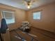 Simple bedroom with two windows, ceiling fan, and closet at 469 80Th Way, St Pete Beach, FL 33706
