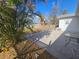 Backyard with patio, shed, and tropical plants at 469 80Th Way, St Pete Beach, FL 33706