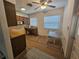 Kitchen with wood cabinets, microwave, and dining area at 469 80Th Way, St Pete Beach, FL 33706