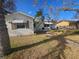 Front view of a single-story house with palm trees and a walkway at 469 80Th Way, St Pete Beach, FL 33706