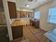Kitchen with wood cabinets and appliances at 469 80Th Way, St Pete Beach, FL 33706