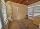 Bright sunroom with wood ceiling, window blinds, and tiled floor at 469 80Th Way, St Pete Beach, FL 33706