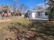 Large backyard with grass, a patio, and a wooden fence at 469 80Th Way, St Pete Beach, FL 33706