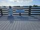 View of Ron McKenney Pier with signage and waterfront backdrop at 469 80Th Way, St Pete Beach, FL 33706
