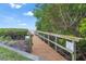 Wooden walkway leads to a private dock with water access at 6372 Palma Del Mar S Blvd # 320, St Petersburg, FL 33715