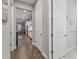 Bright hallway with wood-look floors leading to kitchen at 101 Brookover Ln, Brandon, FL 33511