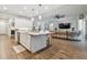 Open concept kitchen with large island, white cabinets, and stainless steel appliances at 101 Brookover Ln, Brandon, FL 33511