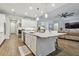 Modern kitchen with white cabinets, granite island, and stainless steel appliances at 101 Brookover Ln, Brandon, FL 33511