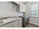 Laundry room with a sink and modern appliances at 101 Brookover Ln, Brandon, FL 33511