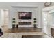 Spacious living room with large sectional sofa, plush rug, and stone accent wall at 101 Brookover Ln, Brandon, FL 33511