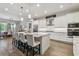 Modern kitchen with white cabinets, granite island, and stainless steel appliances at 101 Brookover Ln, Brandon, FL 33511