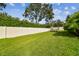 Spacious backyard with grassy lawn and fence at 101 Brookover Ln, Brandon, FL 33511