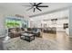 Open concept living area showcasing a sectional sofa and a view into the kitchen at 101 Brookover Ln, Brandon, FL 33511