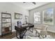 Home office with a large desk, comfortable chairs, and ample natural light at 101 Brookover Ln, Brandon, FL 33511