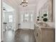 Bright and spacious entryway with wood-look floors and decorative console table at 101 Brookover Ln, Brandon, FL 33511
