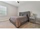 Bedroom with a bed, nightstand, and ceiling fan at 101 Brookover Ln, Brandon, FL 33511