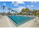 Community swimming pool with lounge chairs and patio at 3832 Lanyard Ct, New Port Richey, FL 34652