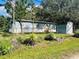 Mobile home with detached shed and yard at 10642 Shalimar St, New Port Richey, FL 34654