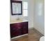 Bathroom with vanity and wood cabinet at 10642 Shalimar St, New Port Richey, FL 34654