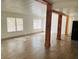 Spacious living area with large windows and wood-look floors at 10642 Shalimar St, New Port Richey, FL 34654