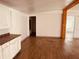 Open living area with wood-look floors and exposed beams at 10642 Shalimar St, New Port Richey, FL 34654