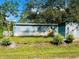 Mobile home with detached shed and yard at 10642 Shalimar St, New Port Richey, FL 34654