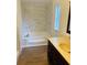 Clean bathroom with updated vanity and bathtub at 10642 Shalimar St, New Port Richey, FL 34654