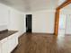Open living area with wood-look floors and exposed beams at 10642 Shalimar St, New Port Richey, FL 34654