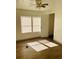 Bright bedroom with wood-look floors and window at 10642 Shalimar St, New Port Richey, FL 34654
