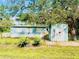 Mobile home with detached shed and yard at 10642 Shalimar St, New Port Richey, FL 34654