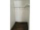 Empty closet with wire shelving and wood-look floors at 10642 Shalimar St, New Port Richey, FL 34654