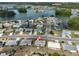 Aerial view of a single-story home in a lakeside community with beautiful views at 1529 Allegheny Dr, Sun City Center, FL 33573