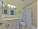 The bathroom features a single sink vanity, toilet, shower and tub combination at 1529 Allegheny Dr, Sun City Center, FL 33573