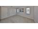 Bright bedroom with carpet, featuring natural light and closet space at 1529 Allegheny Dr, Sun City Center, FL 33573