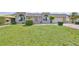 Well-maintained single-story home with a manicured lawn and neatly trimmed hedges at 1529 Allegheny Dr, Sun City Center, FL 33573