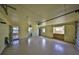 This spacious garage features an epoxy floor, work bench and room for storage at 1529 Allegheny Dr, Sun City Center, FL 33573