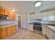 Well-lit kitchen featuring a stainless steel oven, light countertops, and neutral cabinets at 1529 Allegheny Dr, Sun City Center, FL 33573