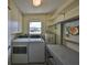 This laundry room has a washer, dryer, utility sink and space for storage at 1529 Allegheny Dr, Sun City Center, FL 33573