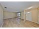 Inviting living room featuring wood-look floors, neutral paint, and ample natural light at 1529 Allegheny Dr, Sun City Center, FL 33573