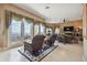 Spacious living room with water views and fireplace at 1679 Sea Breeze Dr, Tarpon Springs, FL 34689