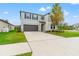 Two-story house with gray exterior and a dark garage door at 1911 Fan Aloe Way, Ruskin, FL 33570