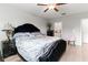 Main bedroom with a king-size bed and ensuite bathroom at 1911 Fan Aloe Way, Ruskin, FL 33570