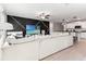 Open living room and kitchen with large sectional sofa at 1911 Fan Aloe Way, Ruskin, FL 33570