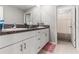Double vanity bathroom with granite countertops and separate shower/tub at 1911 Fan Aloe Way, Ruskin, FL 33570