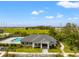 Community clubhouse with pool and surrounding landscape at 1911 Fan Aloe Way, Ruskin, FL 33570