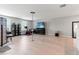 Spacious bonus room with hardwood floors and a home entertainment center at 1911 Fan Aloe Way, Ruskin, FL 33570